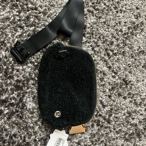 Lululemon Athletica Black Fleece Bag with Gold Zipper